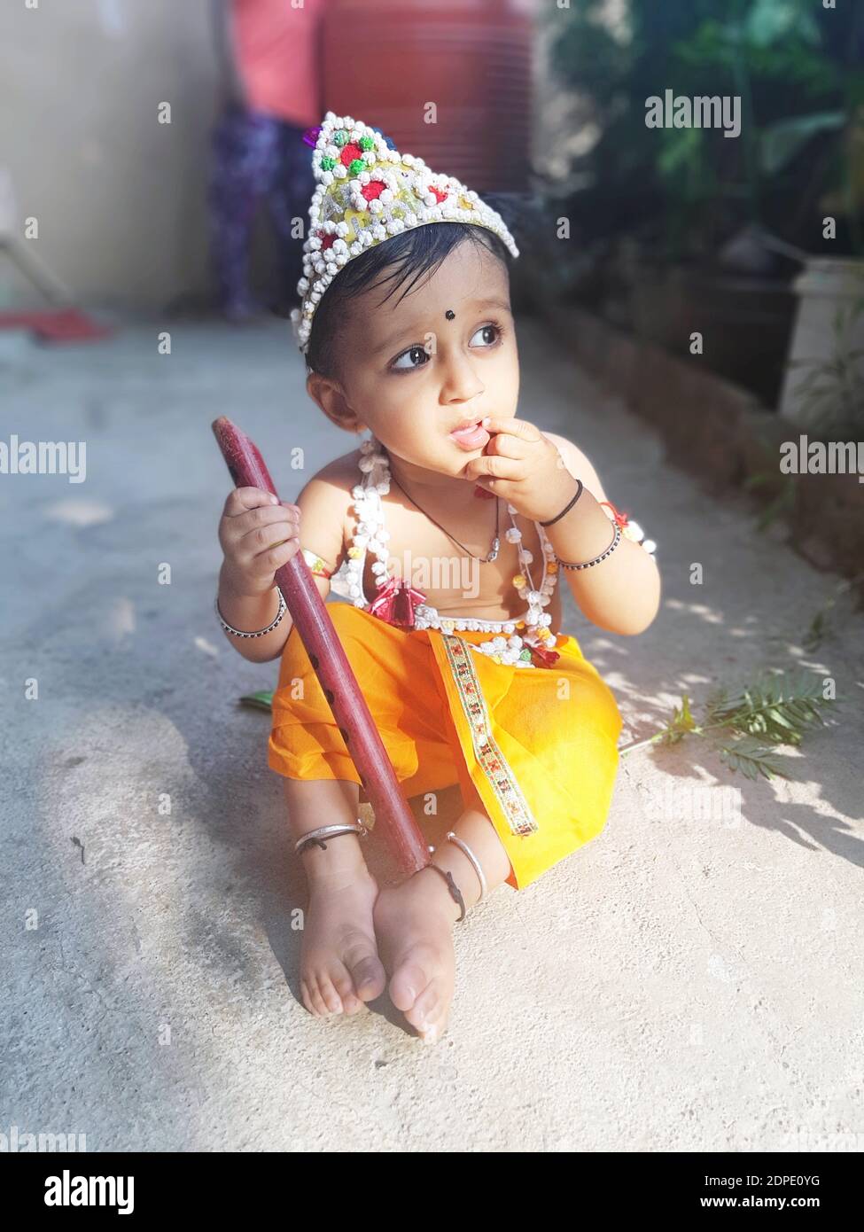 Cute Baby Boy Wearing Krishna Costume While Sitting On Footpath ...