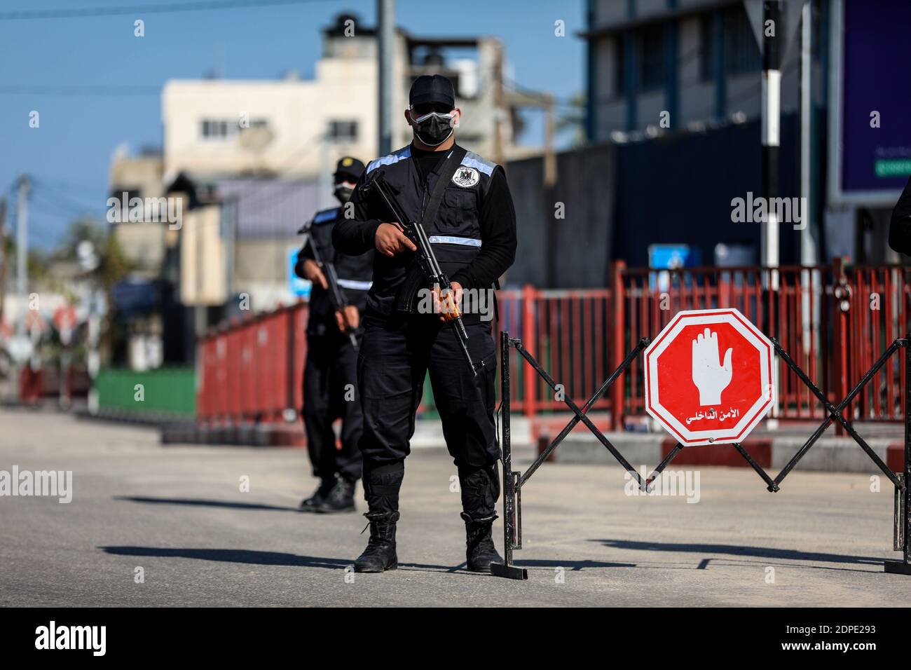 Gaza. 19th Dec, 2020. Palestinian policemen stand guard in the Gaza Strip city of Khan Younis amid a lockdown, on Dec. 19, 2020. A full lockdown and curfew have been imposed in the West Bank and the Gaza Strip to curb the growing numbers of COVID-19 infections and deaths. Credit: Yasser Qudih/Xinhua/Alamy Live News Stock Photo