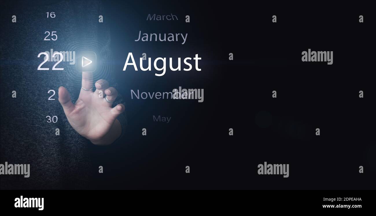August 22nd. Day 22 of month, Calendar date. Hand click luminous icon PLAY and DATE on dark blue background. Summer month, day of the year concept Stock Photo
