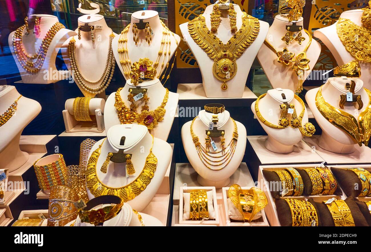 Dubai, UAE - January 31, 2020:  Shop-window of a jewellery shop with golden necklaces in the Golden Market in Dubai, United Arab Emirates Stock Photo