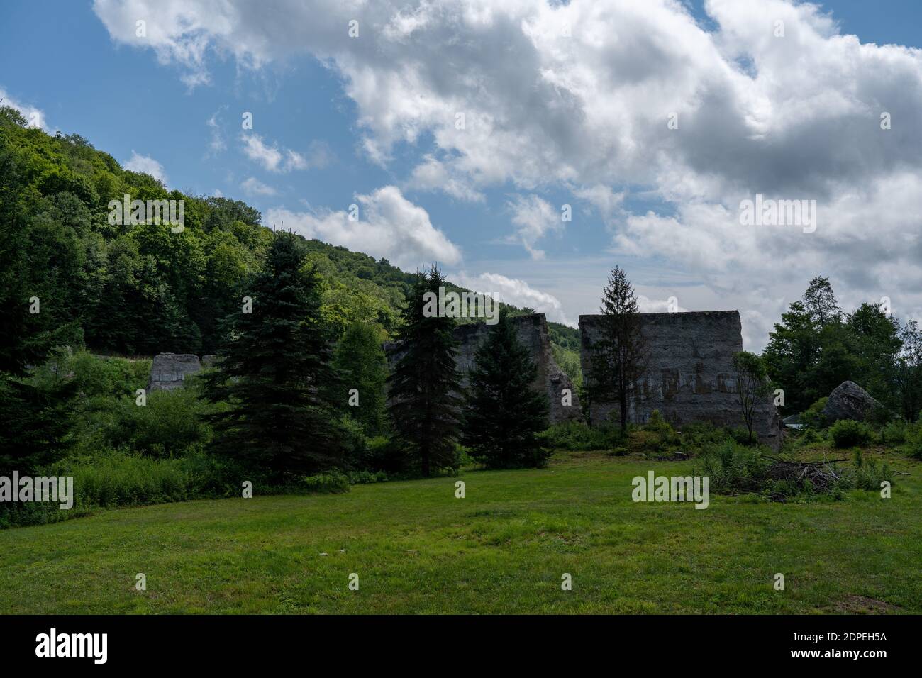 The broken remains of the Austin Dam failure in Austin, Pennsylvania under the cloudy sky Stock