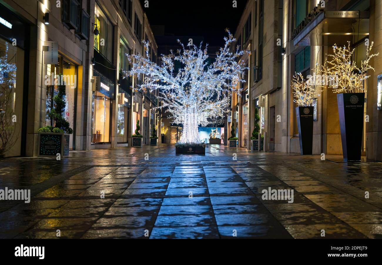 Edinburgh, Scotland, UK. 19 December 2020.  Views of streets and shops in Edinburgh City Centre on evening that Scottish Government announced the highest level 4 lockdown will be enforced from Boxing Day in Scotland.  Pic;  Multrees Walk fashion shopping arcade is deserted. Iain Masterton/Alamy Live News Stock Photo