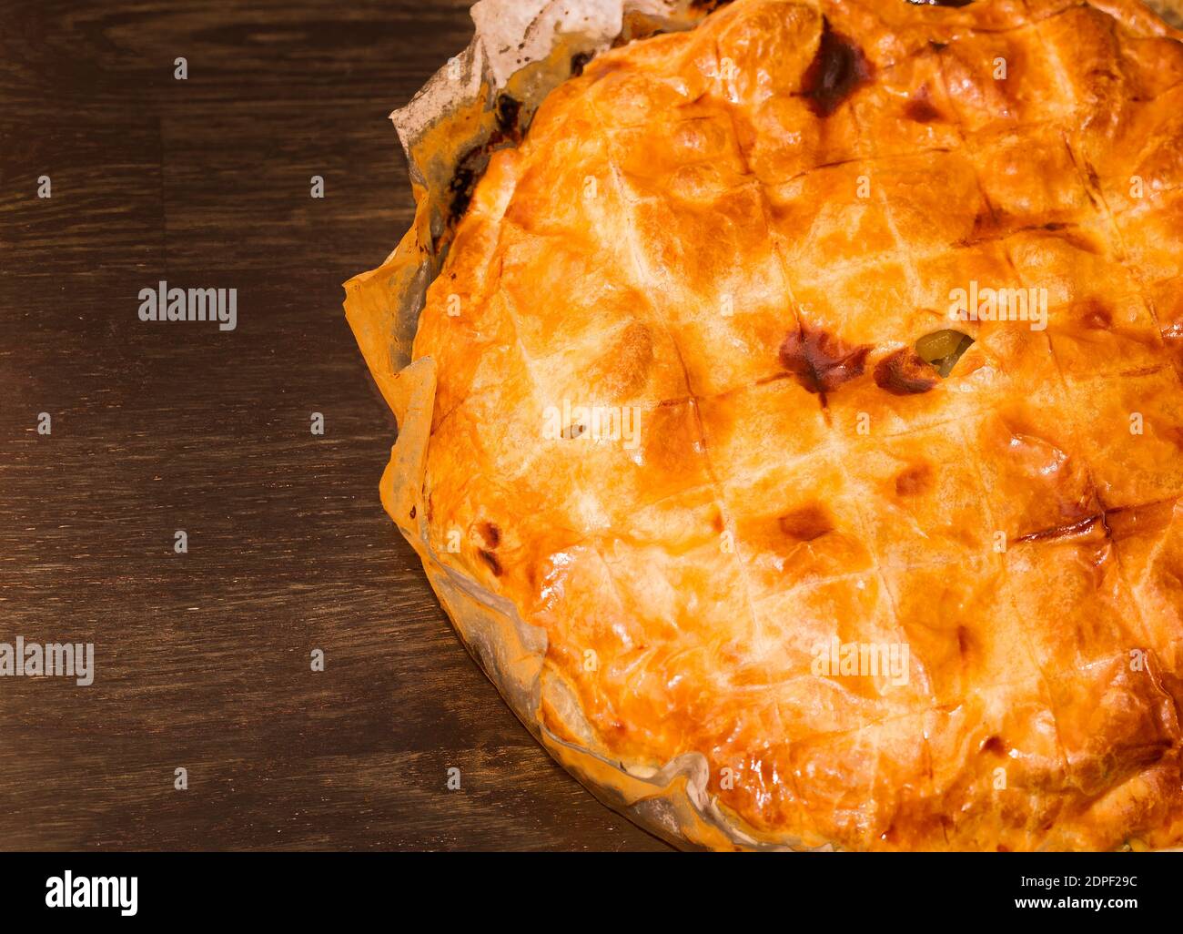 Baked potato pie on a wooden table Stock Photo