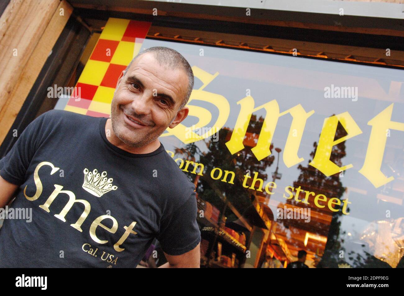 File photo : Christian Audigier presents 'Smet ', his latest fashion collection honoring French rock legend Johnny Hallyday in his store of Melrose Avenue in Los Angeles, CA, USA on July 29, 2006. Ed Hardy designer Christian Audigier has passed away aged 57. The French fashion expert had been battling cancer, Myelodysplastic Syndrome (MDS). Christian was best known for his work with the alternative band Ed Hardy and helped make its destinctive skull and tattoo print famous. Photo by Lionel Hahn/ABACAPRESS.COM Stock Photo