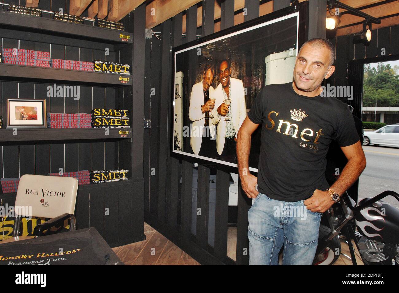 File photo : Christian Audigier presents 'Smet ', his latest fashion collection honoring French rock legend Johnny Hallyday in his store of Melrose Avenue in Los Angeles, CA, USA on July 29, 2006. Ed Hardy designer Christian Audigier has passed away aged 57. The French fashion expert had been battling cancer, Myelodysplastic Syndrome (MDS). Christian was best known for his work with the alternative band Ed Hardy and helped make its destinctive skull and tattoo print famous. Photo by Lionel Hahn/ABACAPRESS.COM Stock Photo