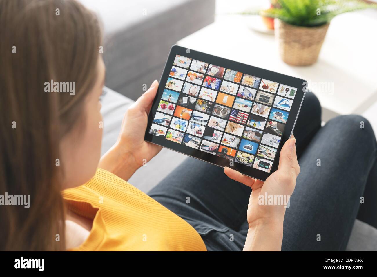 Woman watching TV on tablet. Television, multimedia streaming services