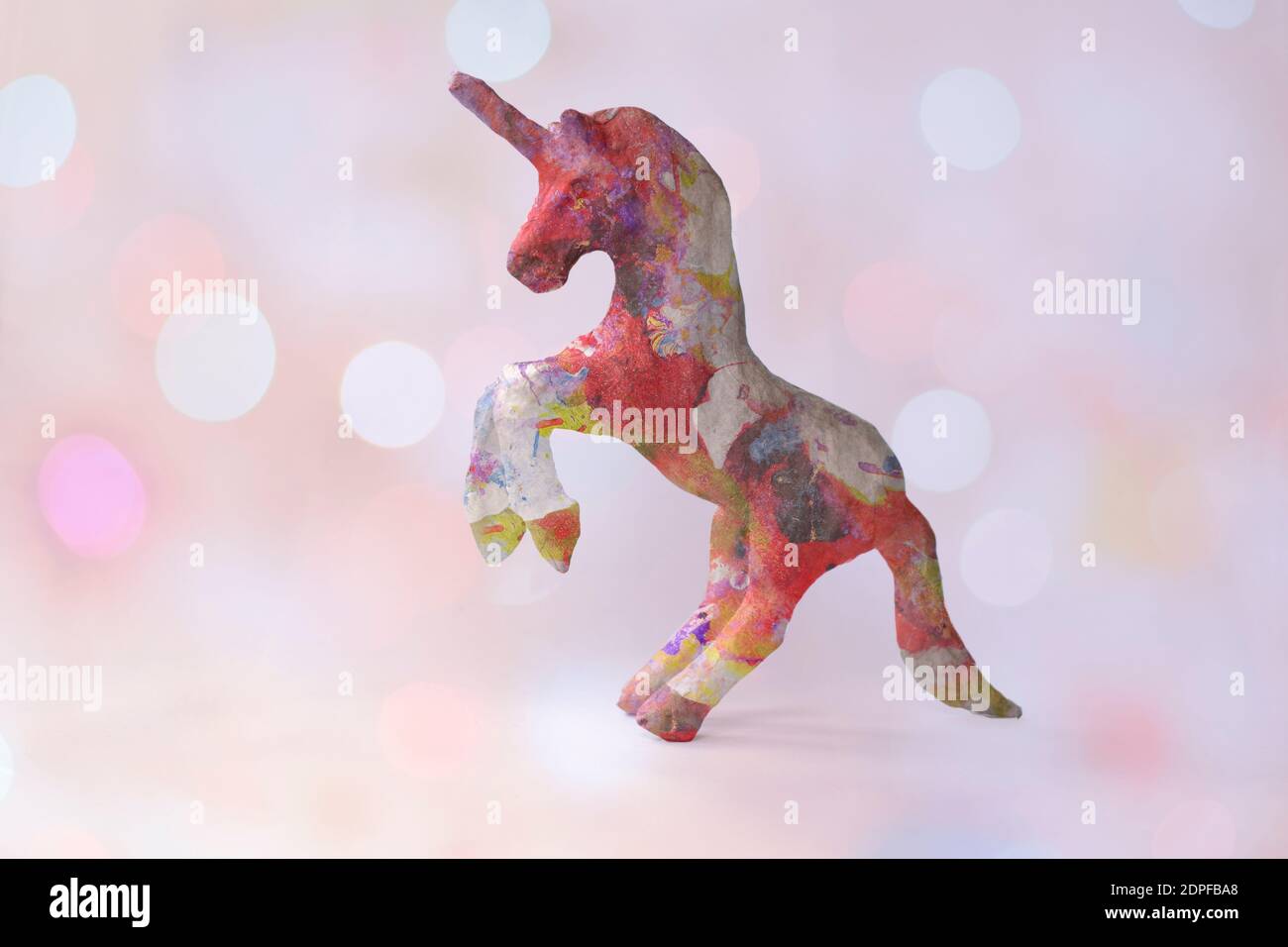 Magical unicorn in a pink glittery dream like cloud Stock Photo
