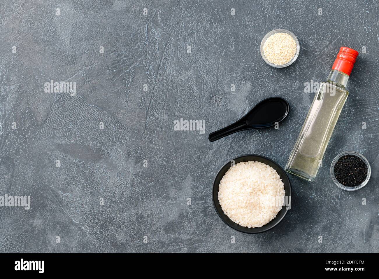 Composition with rice vinegar on dark background Stock Photo