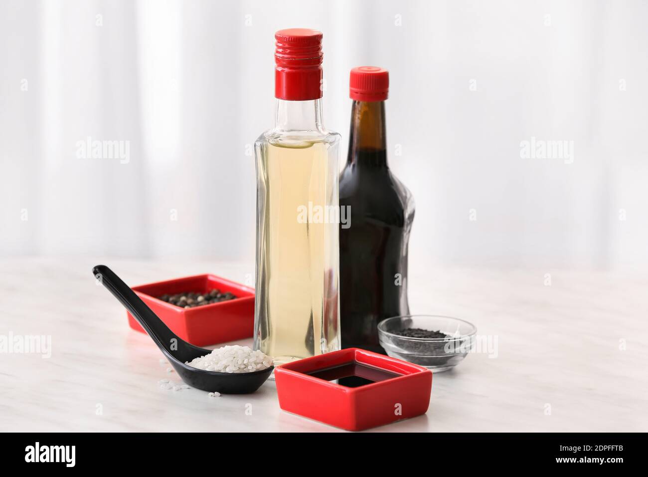 Composition with rice vinegar on table Stock Photo