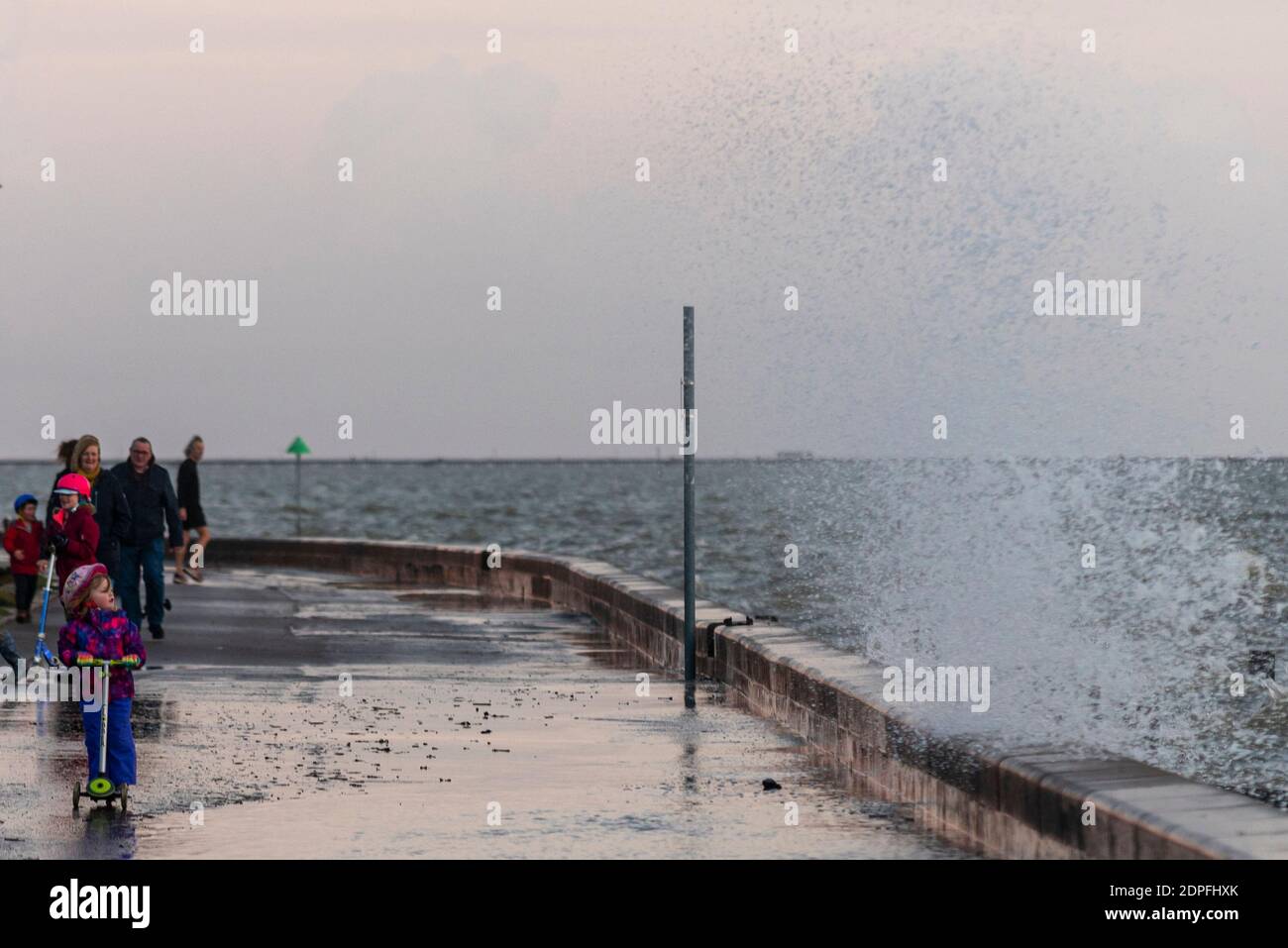 People walking on the seafront in Southend on Sea, Essex, UK, on the last day of tier 3 before going into COVID 19 Coronavirus tier 4. Small child Stock Photo