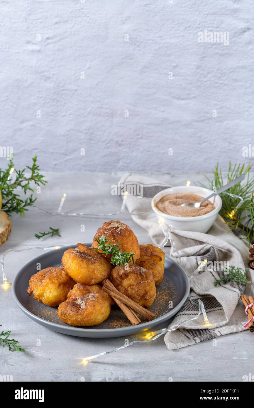 Traditional portuguese Christmas sweets Sonhos with sugar and cinnamon