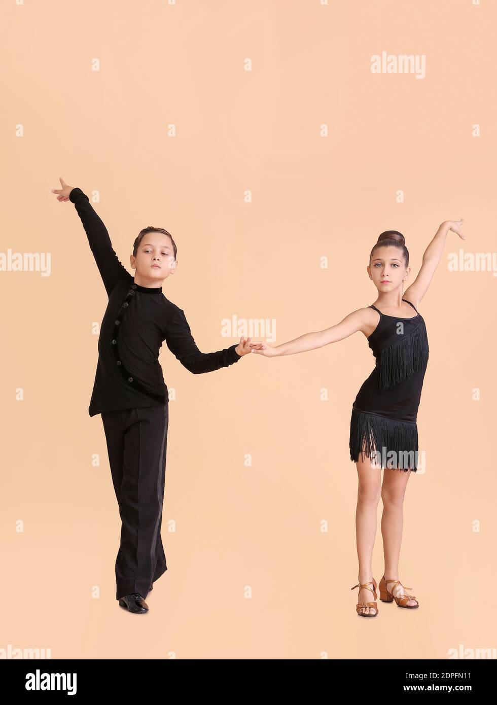 Cute little children dancing against color background Stock Photo Alamy