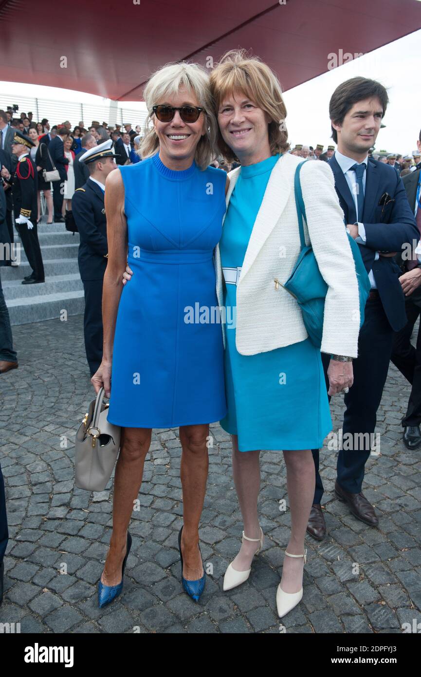 French Minister of the Economy, Industry and the Digital Sector Emmanuel  Macron's wife Brigitte Trogneux (L) and French President Hollande's Chief  of Staff Jean-Pierre Jouyet's wife Brigitte Taittinger during the 2015  annual