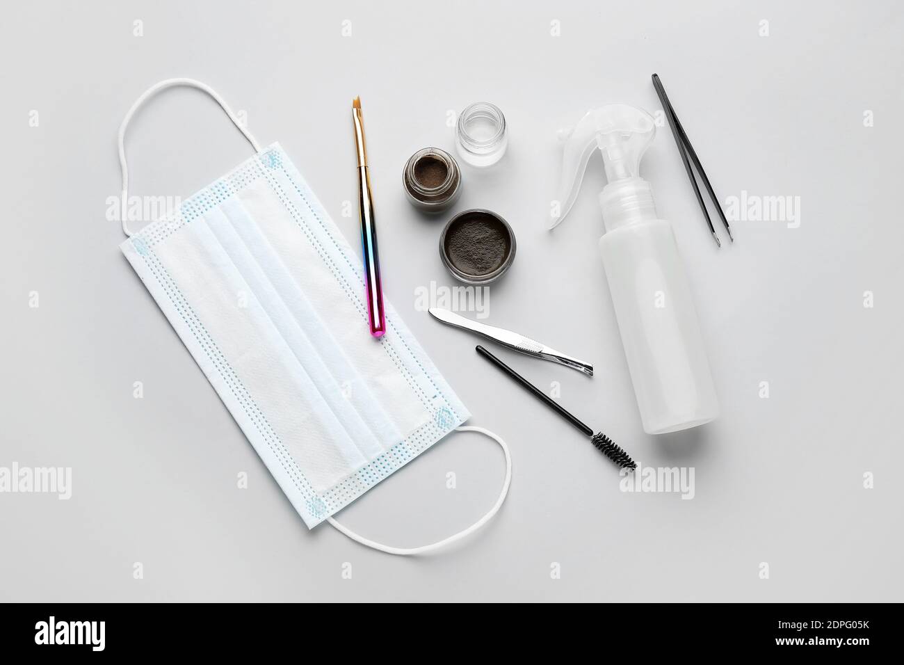 Composition with henna for eyebrows correction on light background Stock Photo