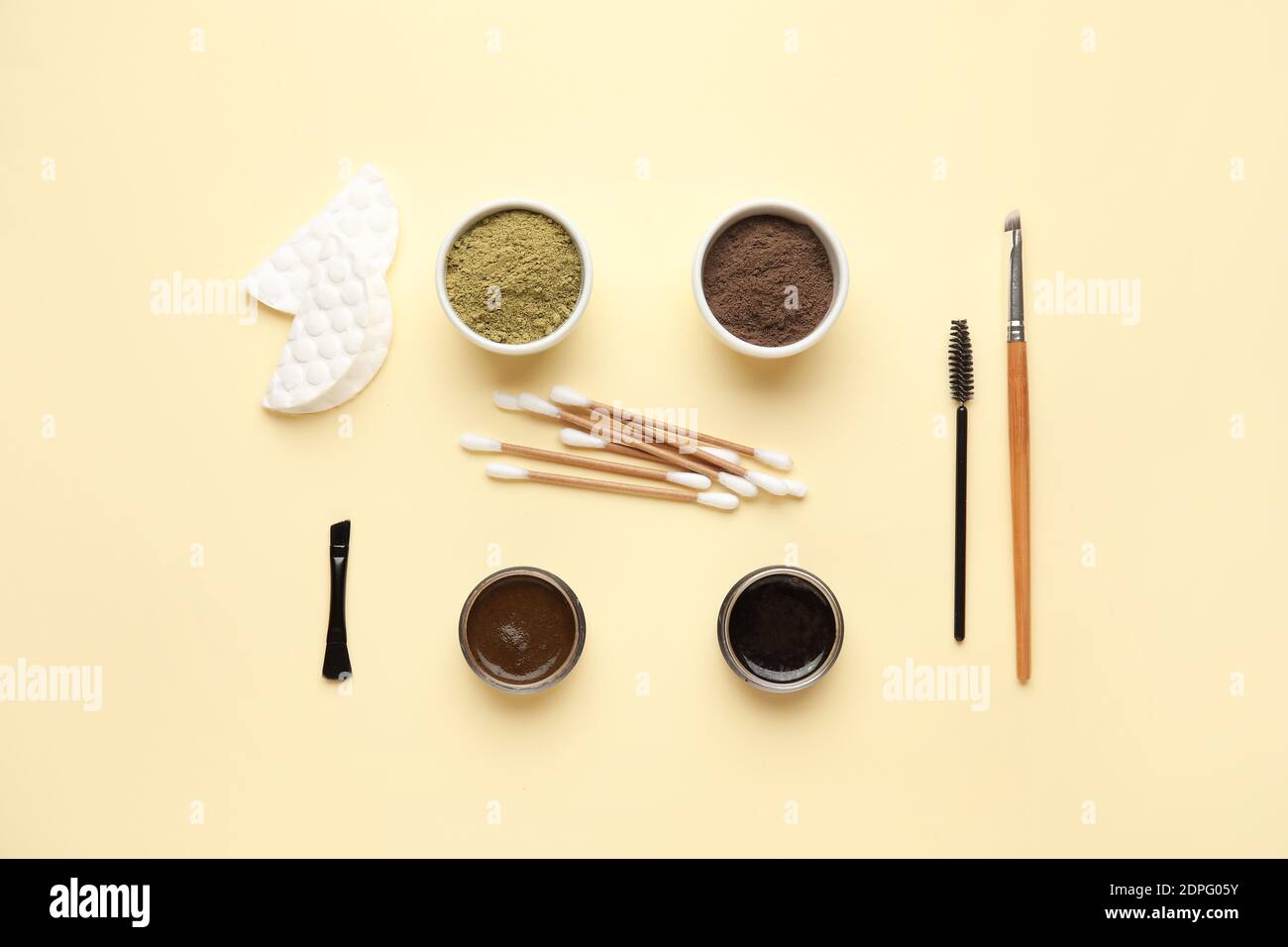 Composition with henna for eyebrows correction on color background Stock Photo