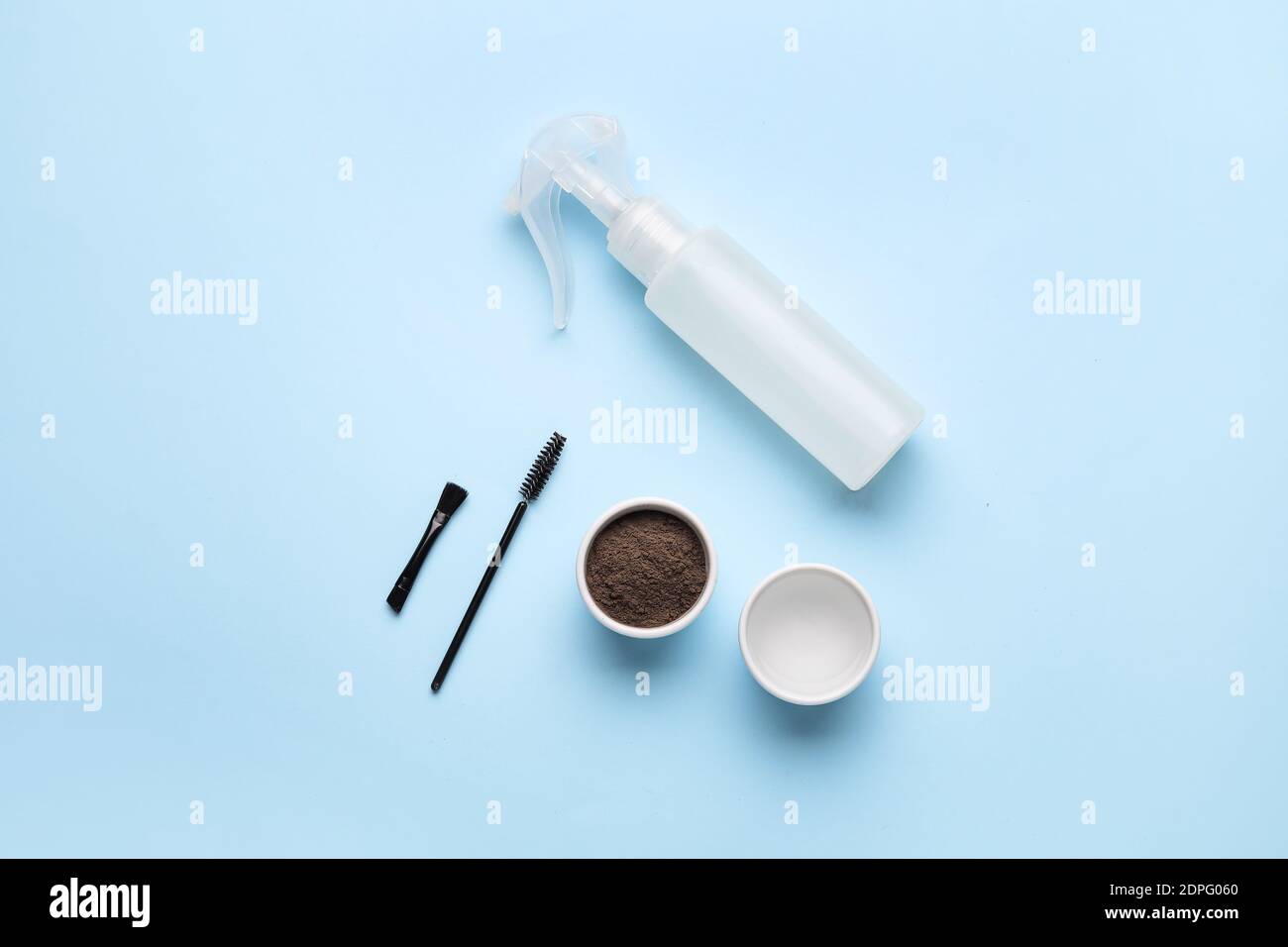 Composition with henna for eyebrows correction on color background Stock Photo