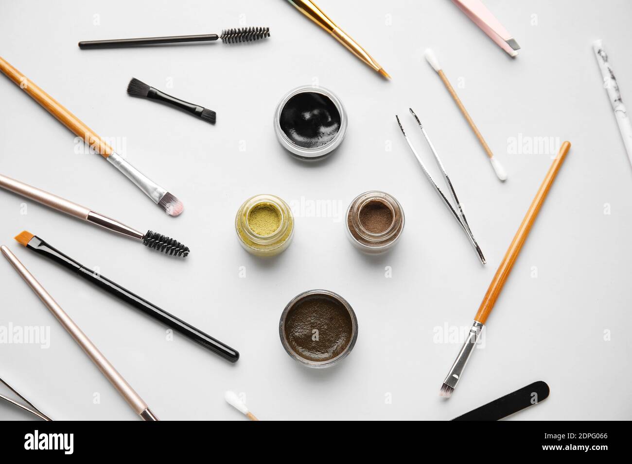 Composition with henna for eyebrows correction on light background Stock Photo