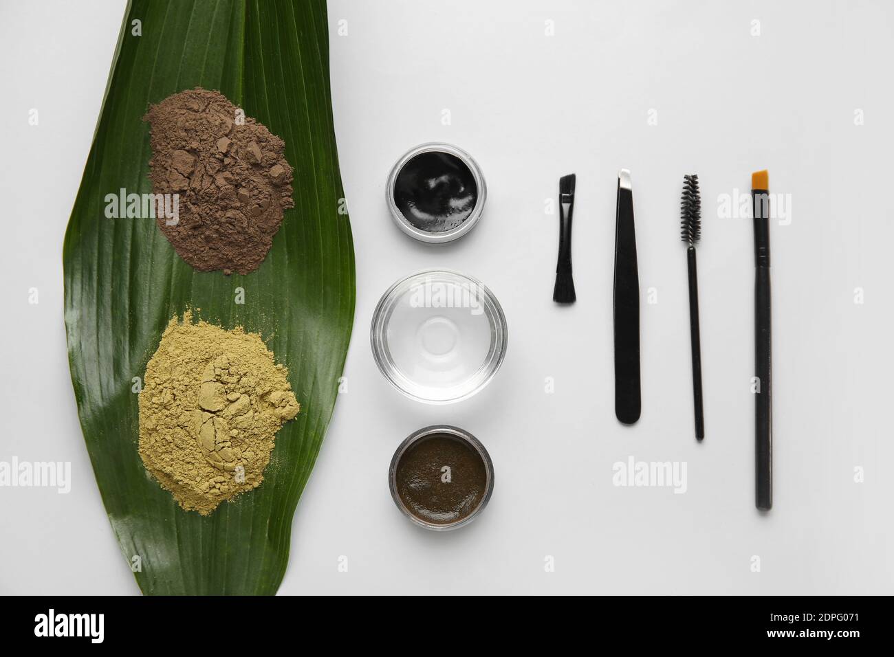 Composition with henna for eyebrows correction on light background Stock Photo