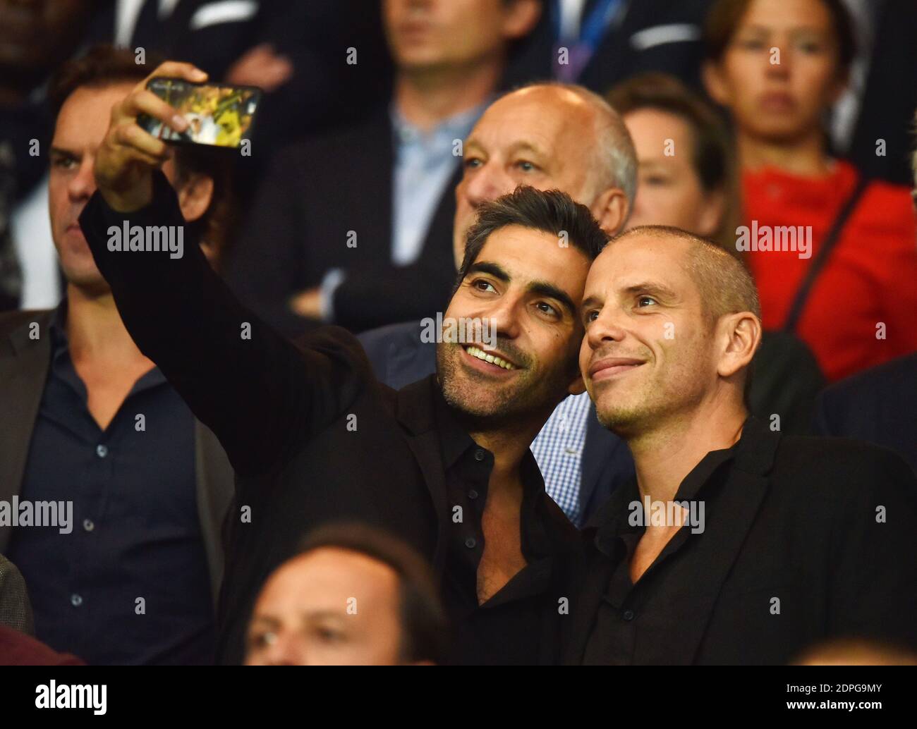 Ary Abittan and Medi Sadoun attending the French First League soccer match Paris St-Germain v Ajaccio at the Parc des Princes in Paris, France on August 16, 2015. PSG won 2-0. Photo by Laurent Zabulon/ABACAPRESS.COM Stock Photo