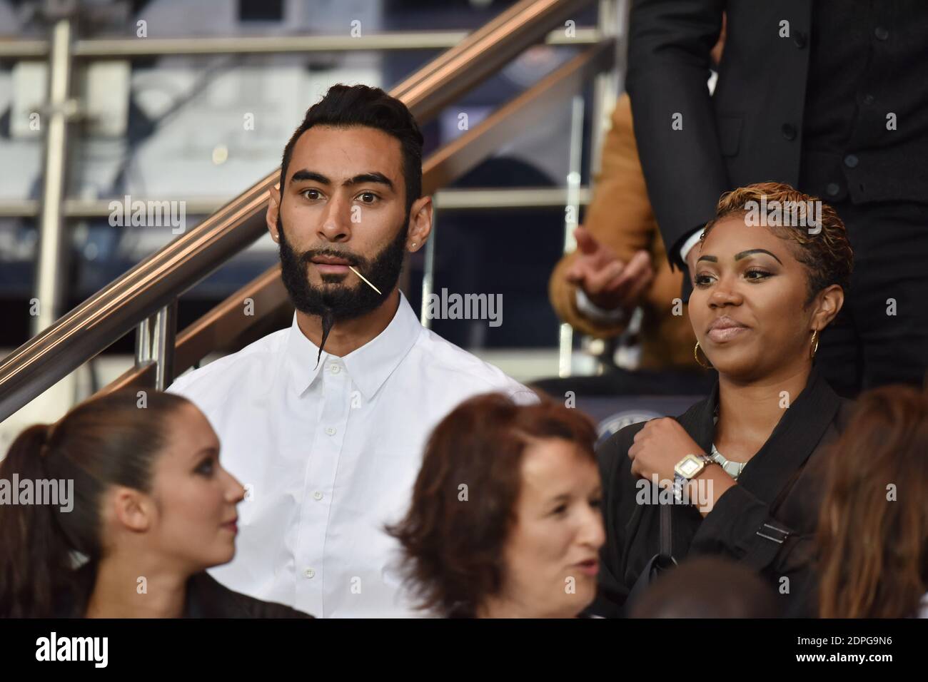 French Rapper La Fouine and his gilrfriend attending the French First