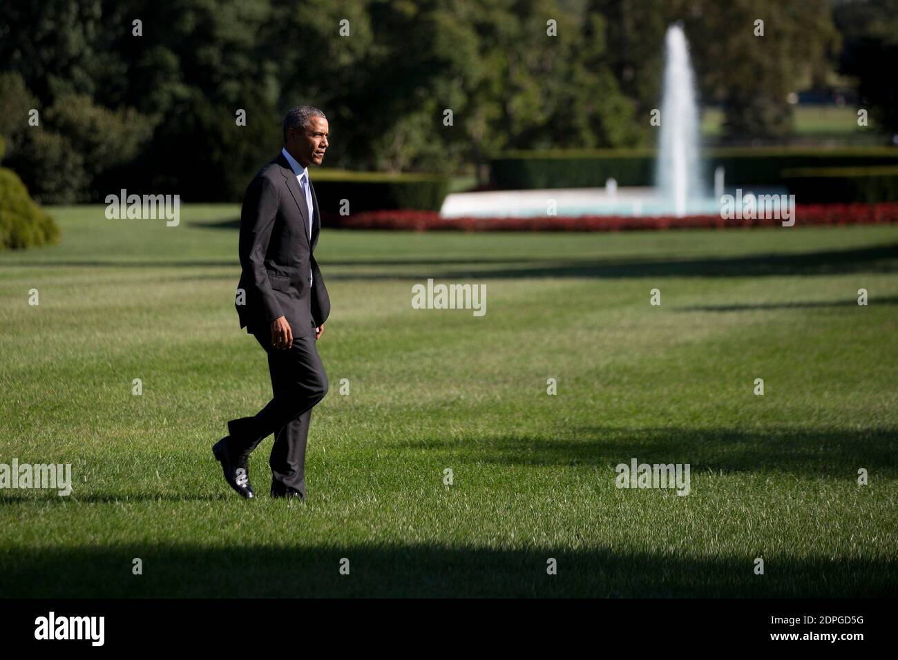 U.S. President Barack Obama walks toward the White House after landing on the South Lawn in Washington, DC, USA, on Tuesday, August 25. Obama pledged yesterday to provide incentives to support investments in renewable energy, saying the industry will thrive despite opposition by Republicans and fossil-fuel suppliers. Photo by Andrew Harrer/Pool/ABACAPRESS.COM Stock Photo