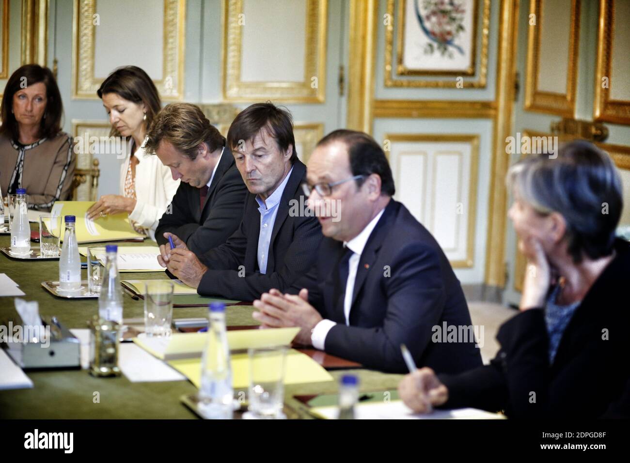 French President Francois Hollande (2nd R) presides over a ministerial meeting including Prime Minister Manuel Valls, Minister of Ecology, Sustainable Development and Energy Segolene Royal, Minister of Foreign Affairs and International Development Laurent Fabius, environmental activist and President Hollande's special envoy for the protection of the planet Nicolas Hulot (3rd R), Deputy Secretary General of the French Presidency Boris Vallaud (4th R) and COP21 special representative Laurence Tubiana (R), in preparation for the COP21 Climate Conference to be held in Paris in December 2015, at th Stock Photo
