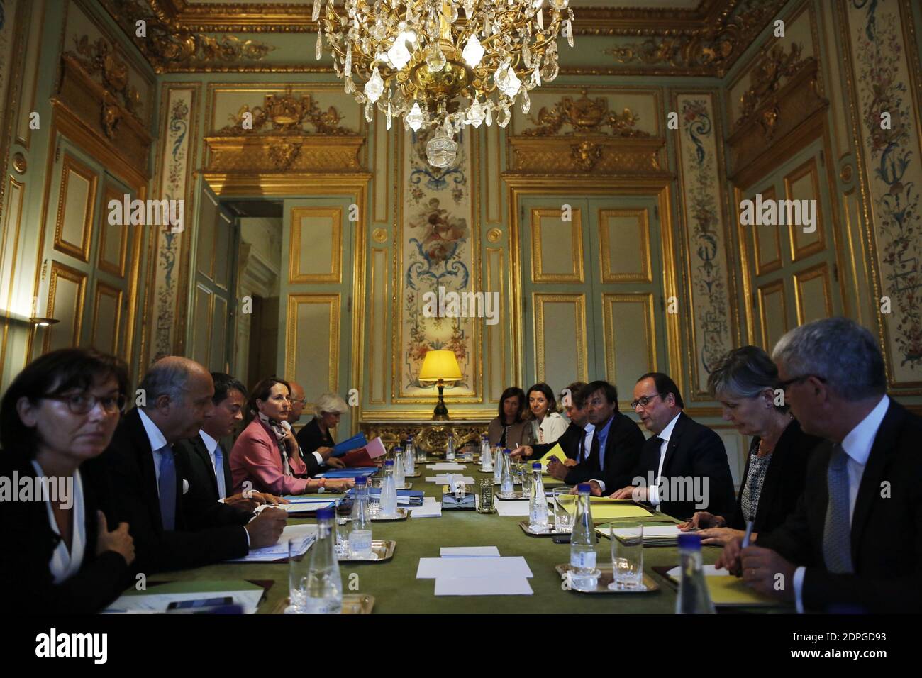 French President Francois Hollande (3rd L) presides over a ministerial meeting including Prime Minister Manuel Valls (3rd L), Minister of Ecology, Sustainable Development and Energy Segolene Royal (4th L), Minister of Foreign Affairs and International Development Laurent Fabius (2nd L), environmental activist and President Hollande's special envoy for the protection of the planet Nicolas Hulot (4th R), COP21 special representative Laurence Tubiana (2nd R) and Deputy Secretary General of the French Presidency Boris Vallaud (5th R), in preparation for the COP21 Climate Conference to be held in P Stock Photo