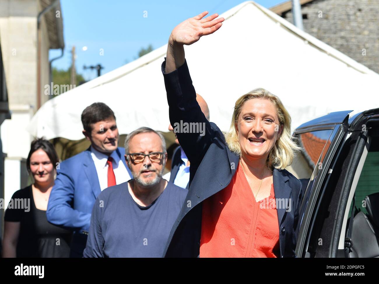 French far-right party Front National president Marine Le Pen waves to the  crowds as she leaves after delivering her annual Discours de Brachay  (Speech of Brachay), ahead of the party's summer university