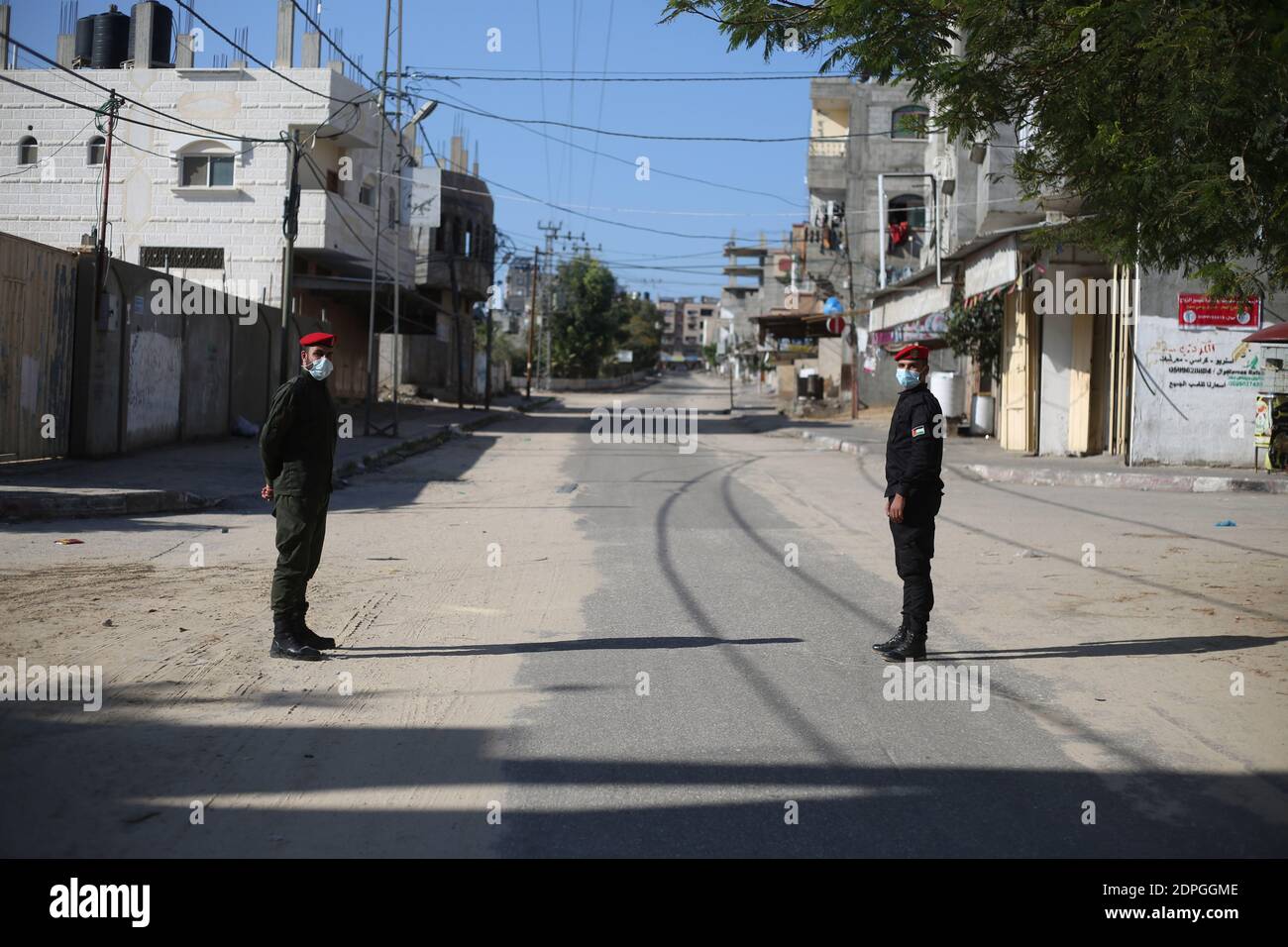 Gaza. 19th Dec, 2020. Palestinian policemen stand guard in the Gaza Strip city of Rafah amid a lockdown, on Dec. 19, 2020. A full lockdown and curfew have been imposed in the West Bank and the Gaza Strip to curb the growing numbers of COVID-19 infections and deaths. Credit: Khaled Omar/Xinhua/Alamy Live News Stock Photo