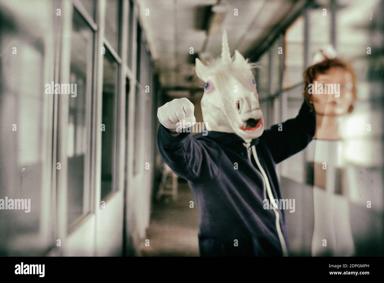 Man wearing horse mask standing hires stock photography and images Alamy