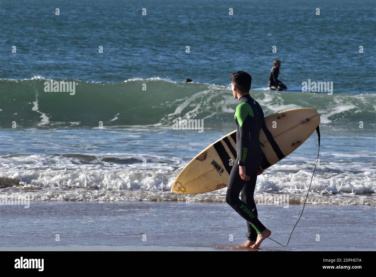 Surfing in Carcavelos beach (praia de Carcavelos) Lisbon, Portugal