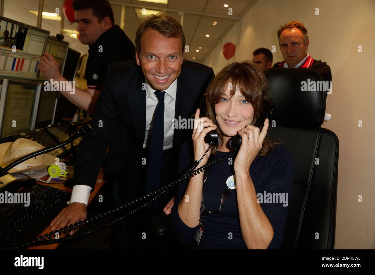 Carla Bruni and Jean-Pierre Aubin attending the BGC Charity Day to honor  the memory of the 658 BGC employees killed in the WTC on 9/11/2001, held in  Aurel BGC headquarters, rue Richelieu