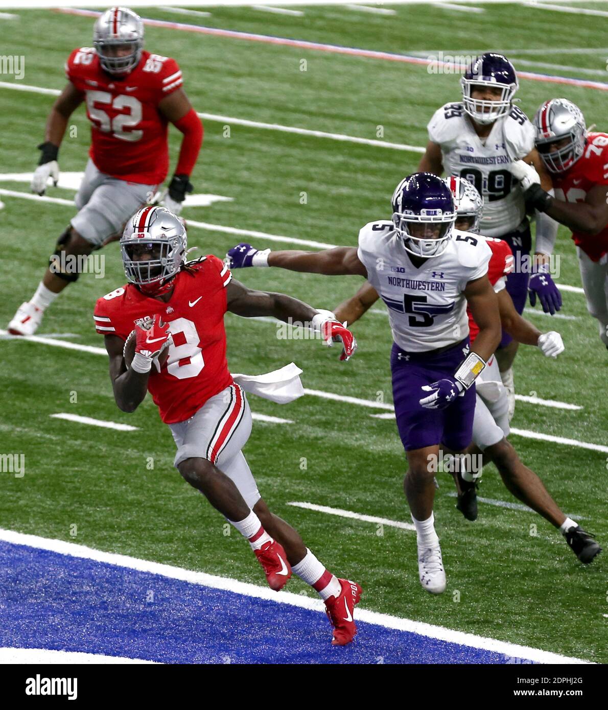 Indianapolis, United States. 19th Dec, 2020. Ohio State Buckeyes running back Trey Sermon (8) runs into the endzone for a second half touchdown against the Northwestern Wildcats in the Big Ten Championship game Saturday, December 19, 2020 in Indianapolis, Indiana. Photo by Aaron Josefczyk/UPI Credit: UPI/Alamy Live News Stock Photo