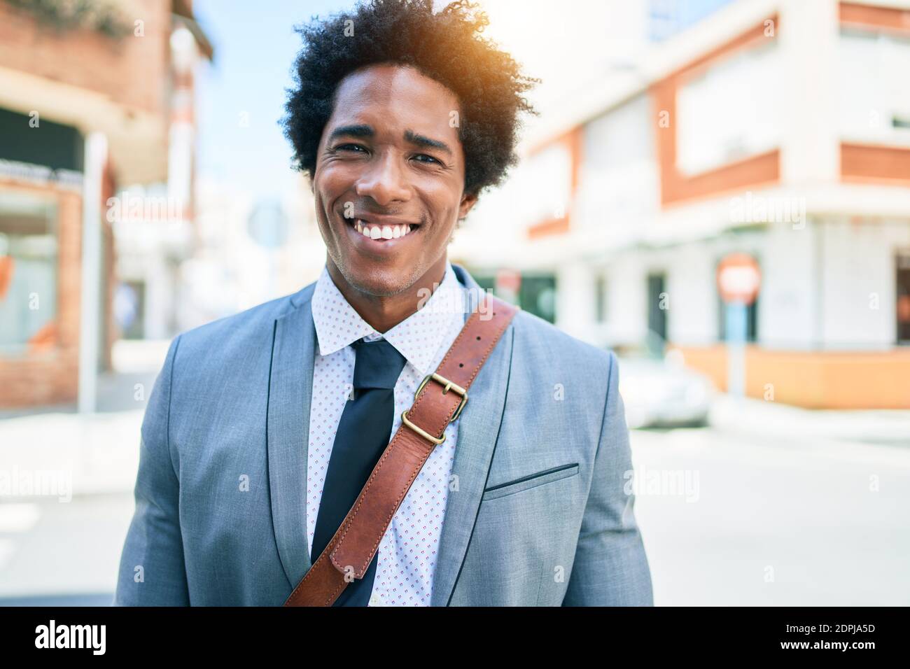 Young handsome african american businessman wearing suit smiling happy ...