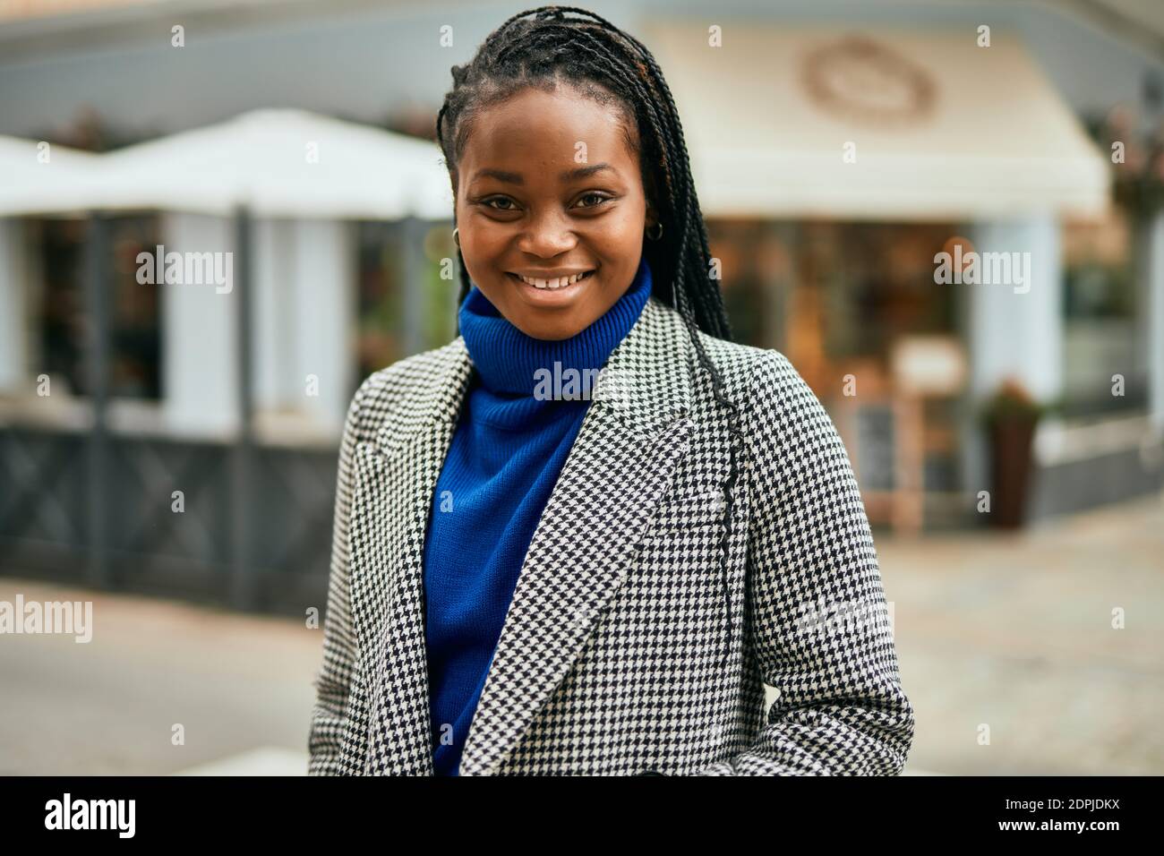 Young african american businesswoman smiling happy standing at the city ...