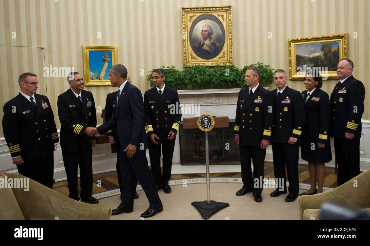 U S President Barack Obama Shakes Hands With Captain Jose Belardo Officer In Charge Team 4 After Meeting With Members Of The Public Health Service Commissioned Corps Phs Cc After Signing A Citation Awarding The