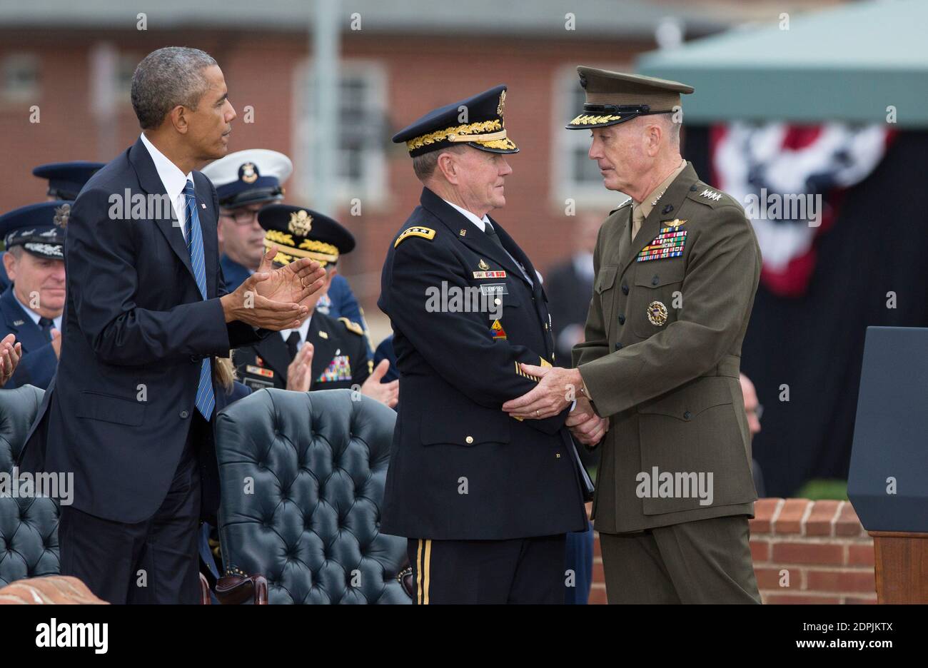 General Martin Dempsey(center) receives congratulations from General Joseph Dunford(right) during Dempsey's retirement ceremony at Fort Myer, Virginia, September 25, 2015. Photo by Chris Kleponis /Pool/ABACAPRESS.COM Stock Photo