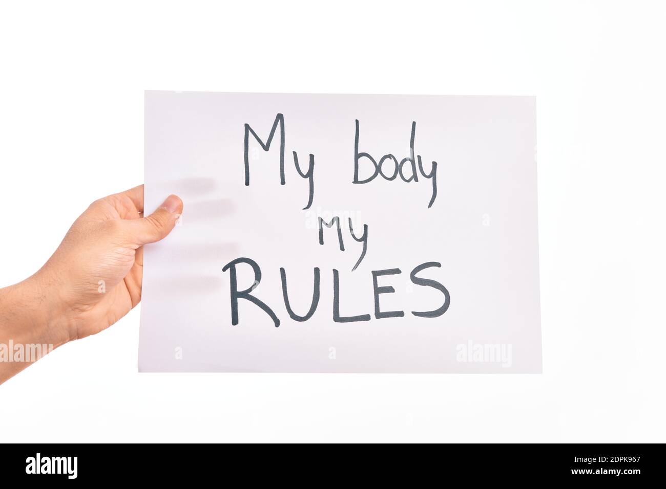 Cardboard banner with MY BODY MY RULES asking for body rights over