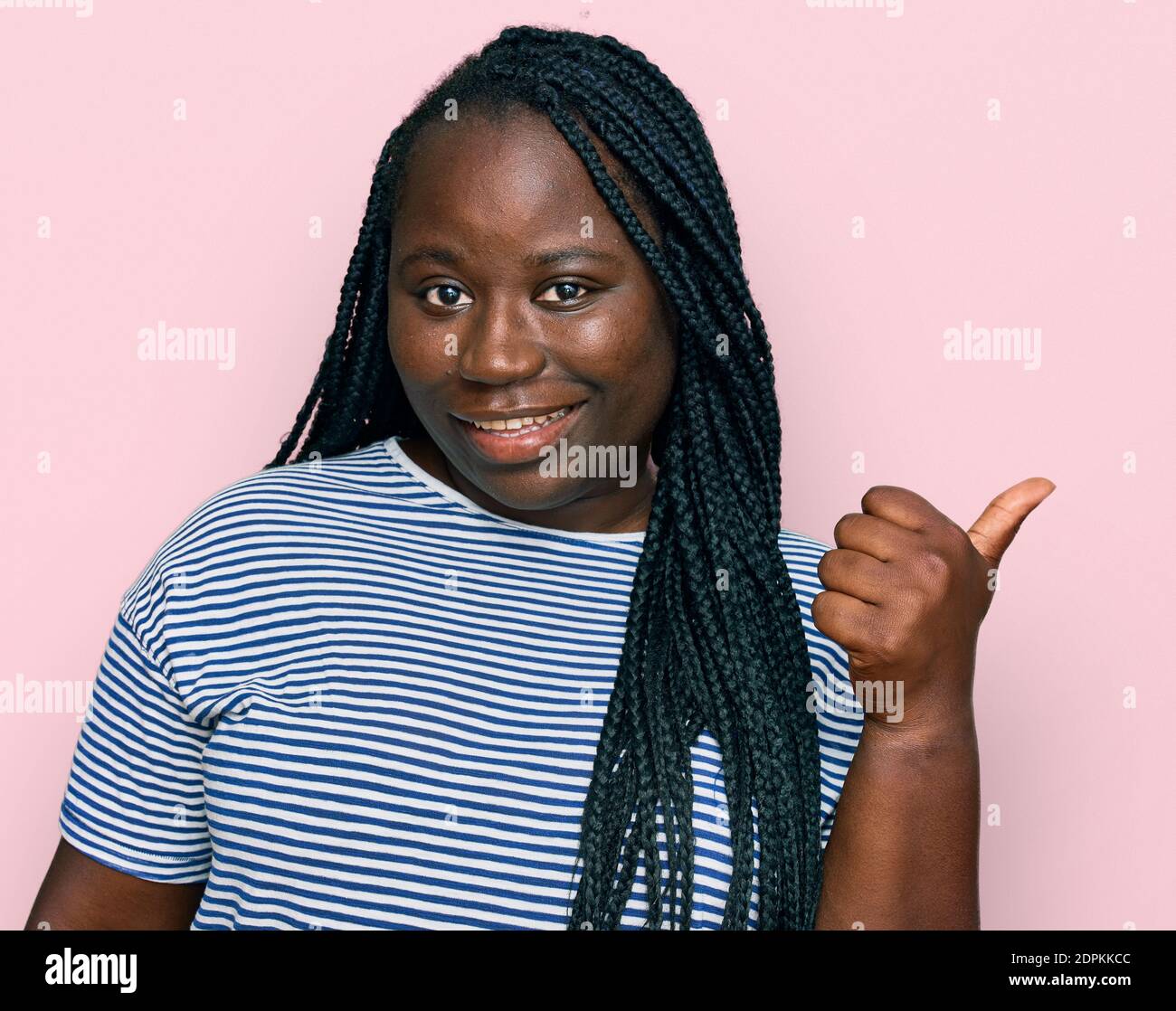 Young black woman with braids wearing casual clothes smiling with happy ...
