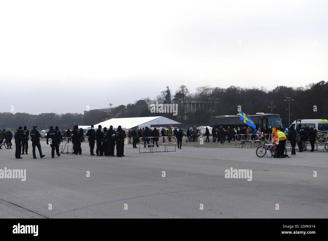 Munich, Germany. 19th Dec, 2020. Police officers accompany a demonstration against the Corona measures on the Theresienwiese. Credit: Felix Hörhager/dpa/Alamy Live News Stock Photo