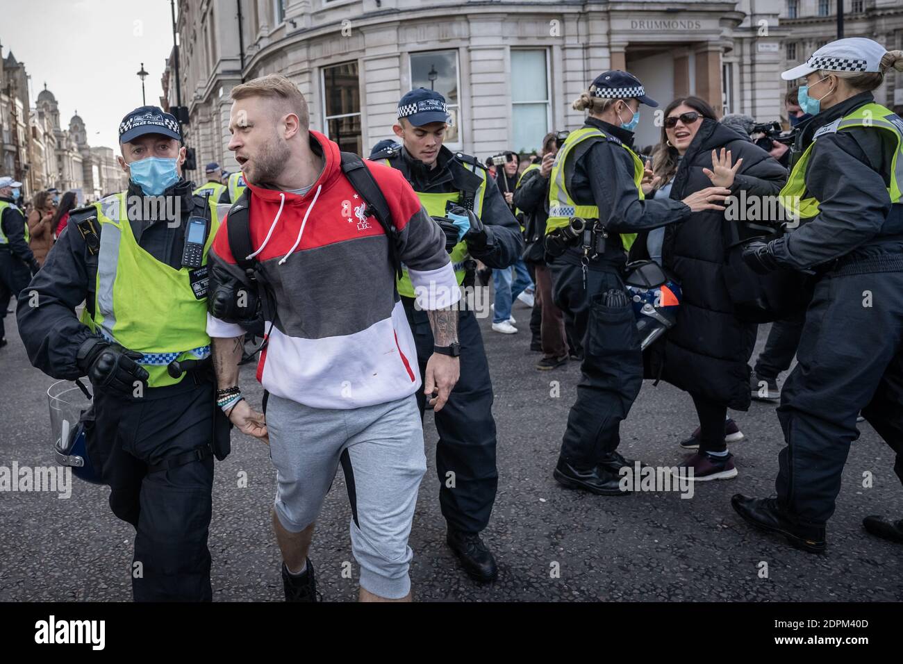 London, UK. 19th Dec, 2020. Coronavirus: Anti-lockdown ‘Unite in the Fight’ protest organised by the conspiracy group Stand Up X. Police struggle to detain activists from several hundred anti-lockdown protestors in a demonstration that came just hours before Prime Minister Boris Johnson announced increased Tier 4 measures across London and the South East of the country. Several arrests are made by Met police. Credit: Guy Corbishley/Alamy Live News Stock Photo