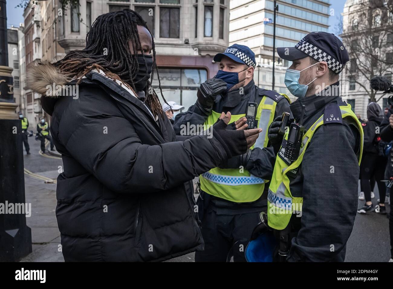 London, UK. 19th Dec, 2020. Coronavirus: Anti-lockdown ‘Unite in the Fight’ protest organised by the conspiracy group Stand Up X. Police struggle to detain activists from several hundred anti-lockdown protestors in a demonstration that came just hours before Prime Minister Boris Johnson announced increased Tier 4 measures across London and the South East of the country. Several arrests are made by Met police. Credit: Guy Corbishley/Alamy Live News Stock Photo