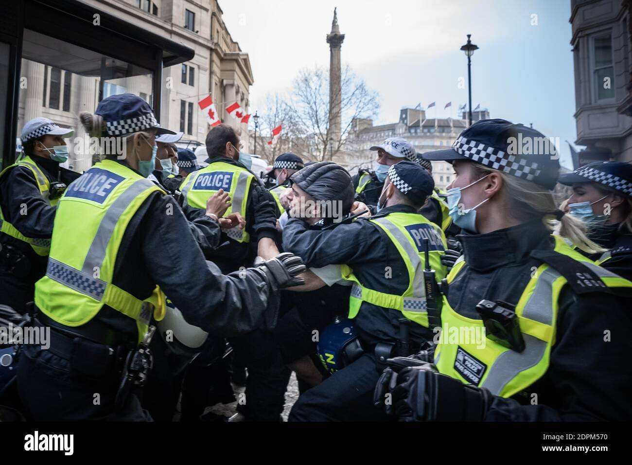 London, UK. 19th Dec, 2020. Coronavirus: Anti-lockdown ‘Unite in the Fight’ protest organised by the conspiracy group Stand Up X. Police struggle to detain activists from several hundred anti-lockdown protestors in a demonstration that came just hours before Prime Minister Boris Johnson announced increased Tier 4 measures across London and the South East of the country. Several arrests are made by Met police. Credit: Guy Corbishley/Alamy Live News Stock Photo