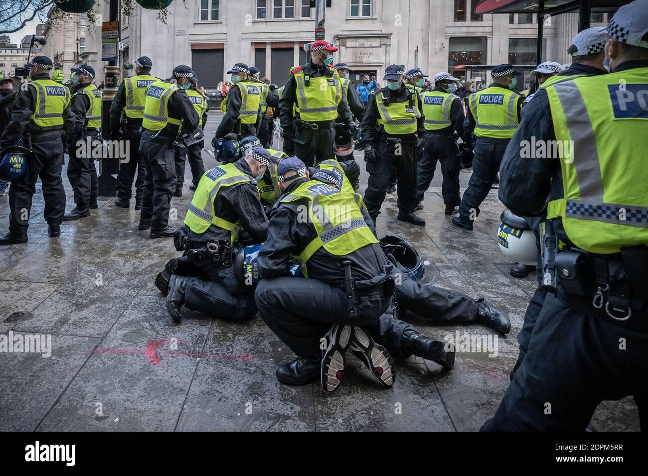 London, UK. 19th Dec, 2020. Coronavirus: Anti-lockdown ‘Unite in the Fight’ protest organised by the conspiracy group Stand Up X. Police struggle to detain activists from several hundred anti-lockdown protestors in a demonstration that came just hours before Prime Minister Boris Johnson announced increased Tier 4 measures across London and the South East of the country. Several arrests are made by Met police. Credit: Guy Corbishley/Alamy Live News Stock Photo