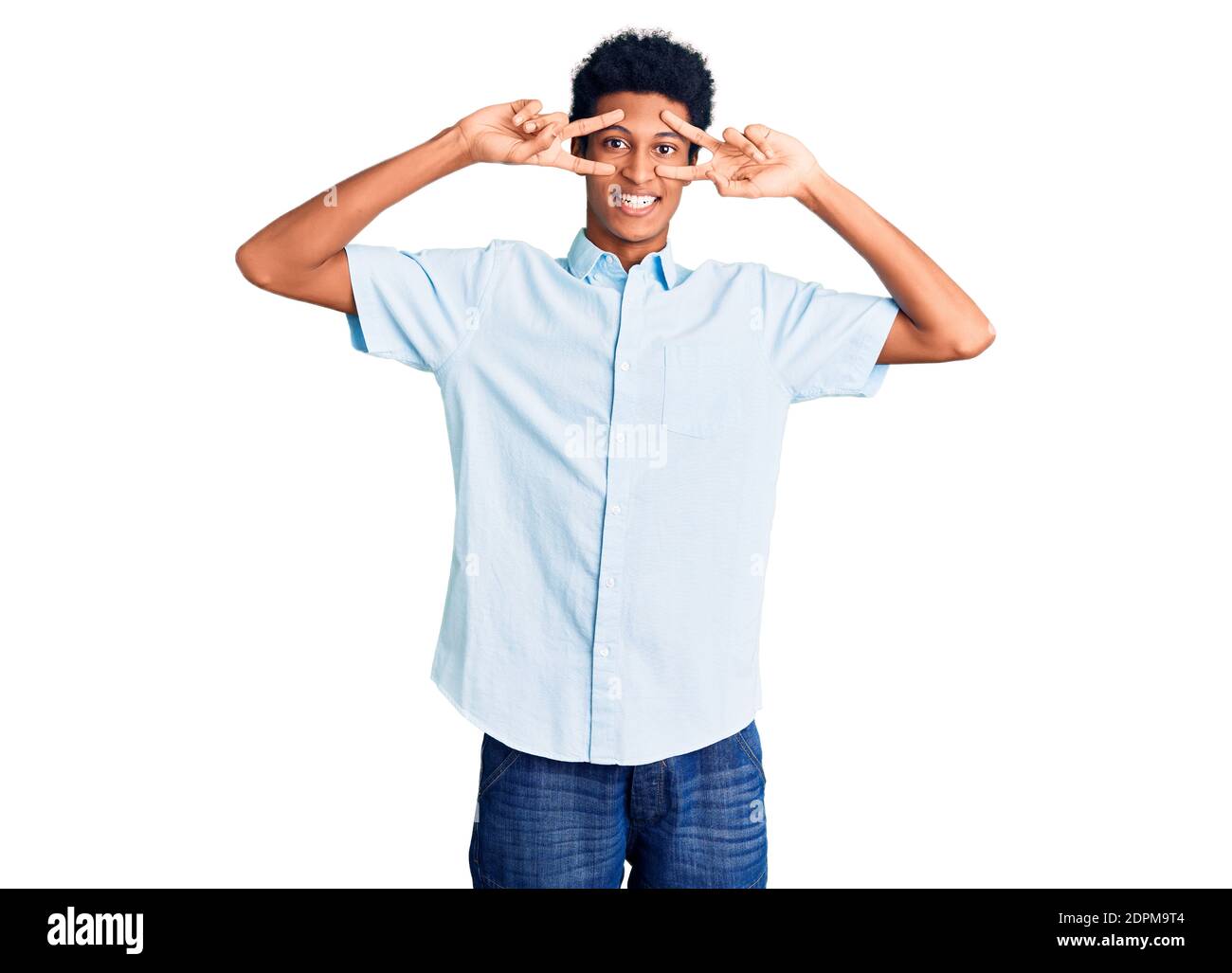 Young african american man wearing casual clothes doing peace symbol ...
