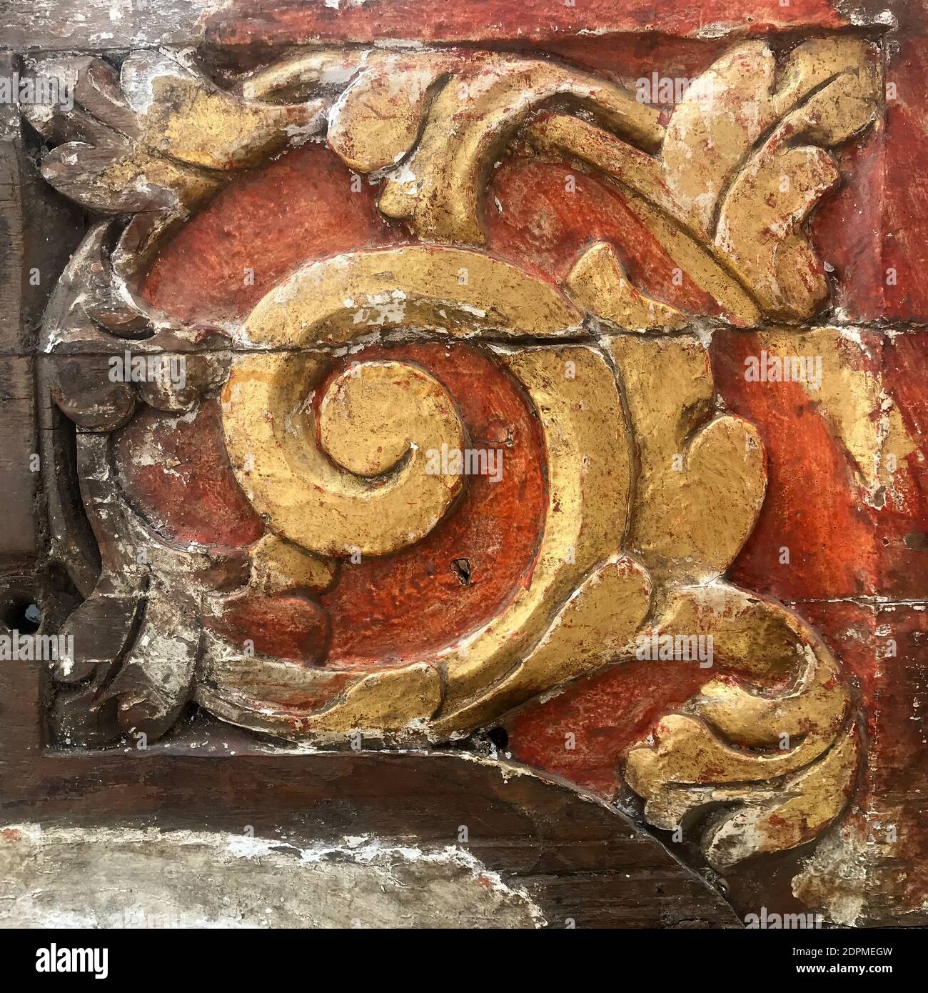 A closeup of a weathered architectural floral flourish detail. Stock Photo