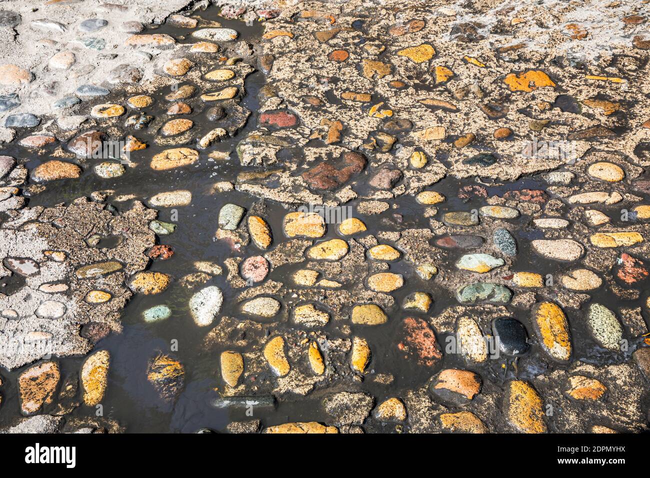 A wet section of rock and concrete street in old Puerto Vallarta, Jalisco, Mexico. Stock Photo