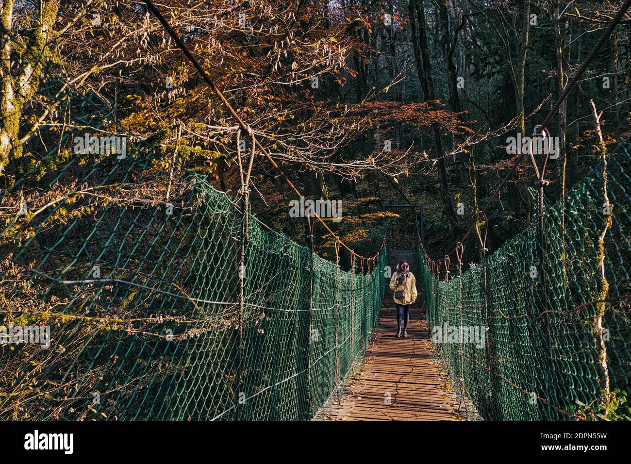 Women crossing wooden bridge hi-res stock photography and images - Alamy