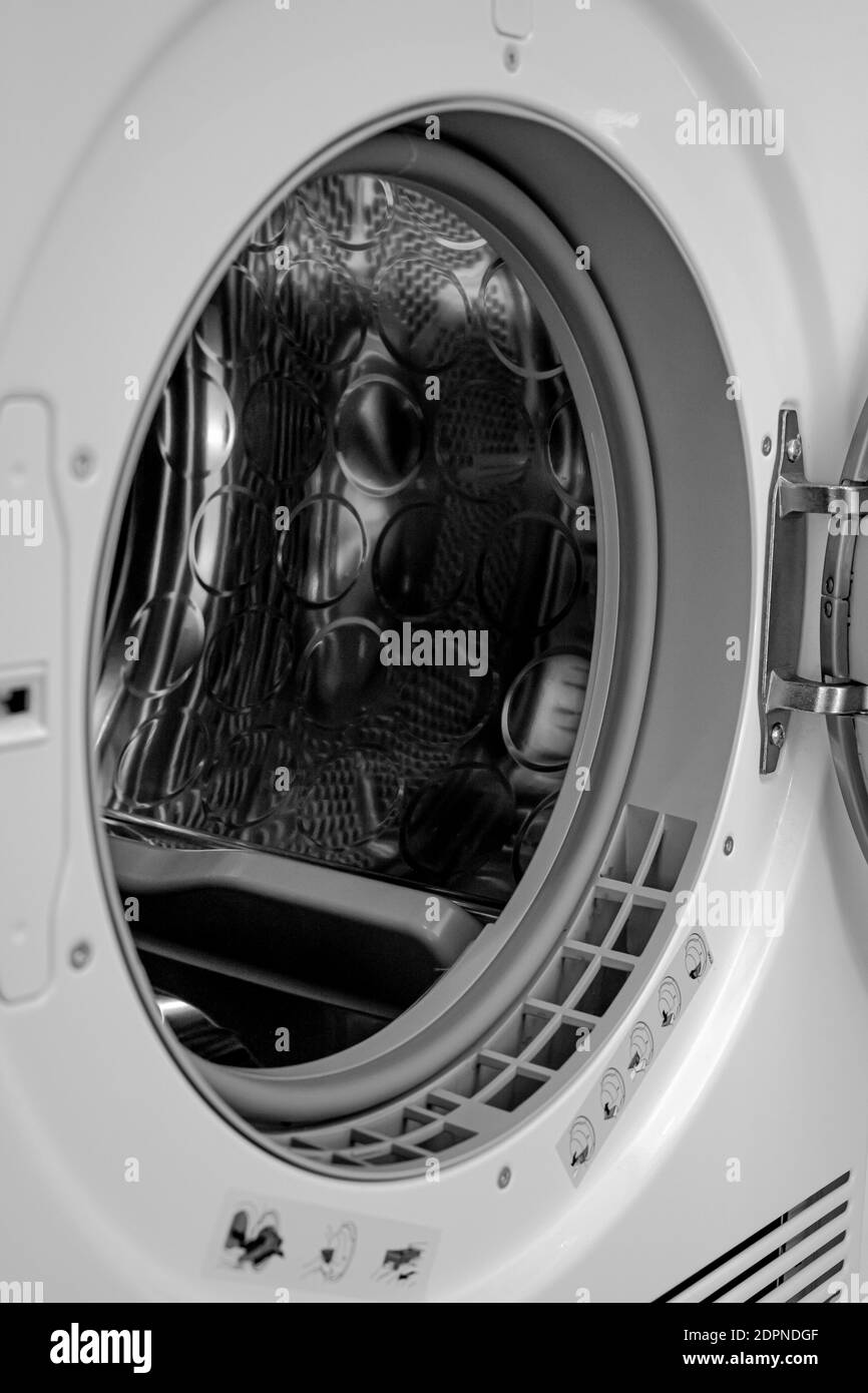 Modern washing machine with empty drum, closeup. High quality photo