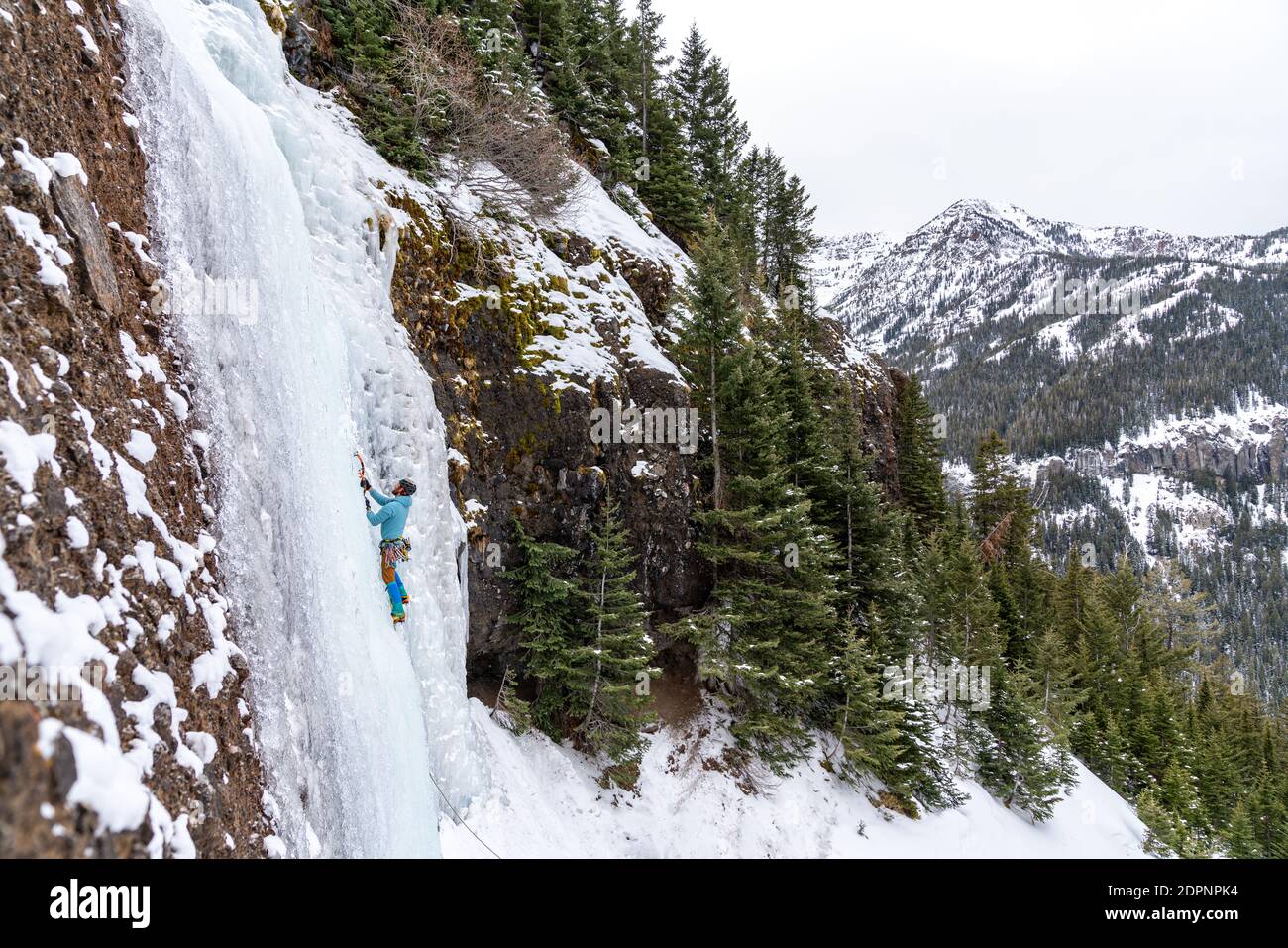 Ice climbers enjoying a day outside climbing frozen waterfalls in Hyalite Canyon Stock Photo